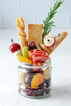 a glass jar filled with assorted snacks