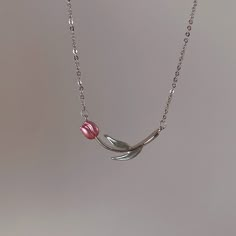 Description:Pink Tulip Chain Necklace Specifications: Size: 38 cm + 8 cm extMaterial: Alloy Metal, EnamelColor: PinkHypoallergenic: Yes This Pink Tulip Chain Necklace will add a fun and playful touch to any outfit! The delicate tulip charm and chain are the perfect combination of whimsical and stylish. Feel like a flower child with this unique necklace. 🌷🌼🌸 Pink Dainty Necklace For Mother's Day, Pink Pendant Charm Necklace With Delicate Chain, Pink Flower Pendant Necklace For Valentine's Day, Valentine's Day Pink Flower Pendant Necklace, Pink Charm Necklace With Adjustable Chain For Mother's Day, Mother's Day Pink Charm Necklace With Adjustable Chain, Trendy Pink Necklace With Adjustable Chain, Trendy Pink Charm Necklaces For Mother's Day, Pink Pendant Necklace With Adjustable Chain