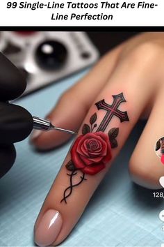 a woman's hand with a rose tattoo on it