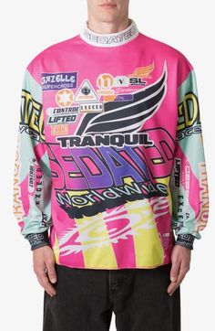 Enter the room in dynamic color with this eye-catching jersey cut from lightweight and breathable mesh. 28" length Mock neck Long sleeves 100% polyester Machine wash, line dry Imported Multicolor Crew Neck Sports Jersey, Pink Sports Jersey With Graphic Print, Sporty All Over Print Crew Neck Jersey, Pink Graphic Print Jersey For Sports Events, Sporty Multicolor Crew Neck Jersey, Sporty All-over Print Crew Neck Jersey, Sporty Crew Neck Jersey With All Over Print, Sporty Multicolor Graphic Print Jersey, Breathable Sportswear Jersey For Streetwear