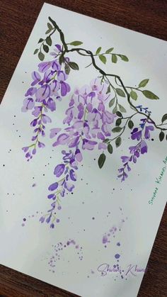 a piece of paper with purple flowers on it