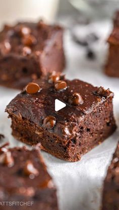 brownies with chocolate chips are sitting on a table