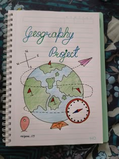 a notebook with the words geography project written on it and an image of a clock