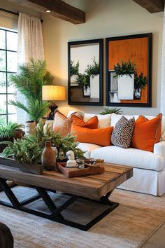 a living room filled with lots of furniture and plants on top of a coffee table