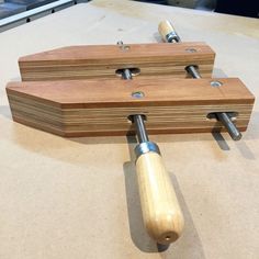 two pieces of wood sit on top of a table