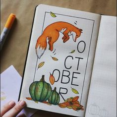 an open notebook with the words october written on it and a drawing of a fox