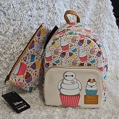 New Loungefly Disney Big Hero 6 Baymax Allover Print Cupcake Mini Backpack And Make-Up Bag. See Pictures For More Details And Measurements. Price Is Firm. Please Do Not Send Offers Unless Bundled With Other Items With A Reasonable Offer. Combine Orders Into A Bundle And Pay For Only One Shipping. C-67 C-61 C-46 Disney Backpack For Everyday Use, Disney Big Hero 6, Backpacks Accessories, Loungefly Bag, Fandom Outfits, Loungefly Disney, Baymax, Cute Backpacks, Hero 6