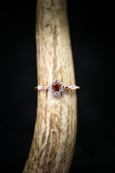 a close up of a wooden object with a ring on it