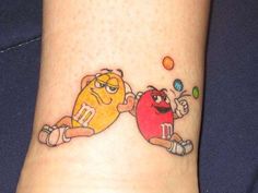 two cartoon character tattoos on the ankle