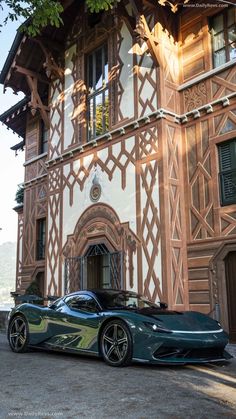 a green sports car parked in front of a building with an ornate design on it