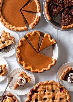 several pies are arranged on paper plates