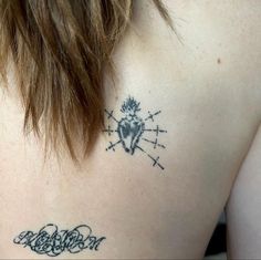 a woman with a tattoo on her back