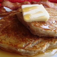 pancakes with butter and syrup are on a plate