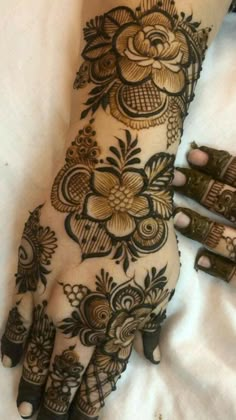 a henna tattoo on someone's hand