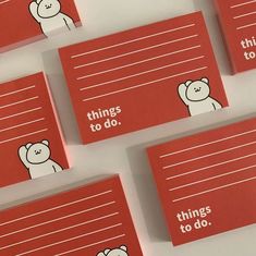 four red cards with white writing on them that say things to do and bear images