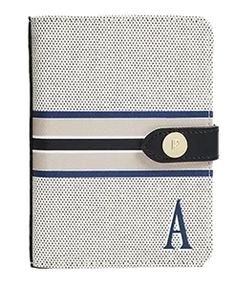 a white notebook with blue and black stripes on the front, and a letter at the bottom