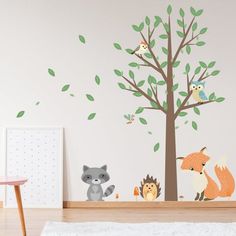 an animal themed wall decal in a child's room with trees and animals