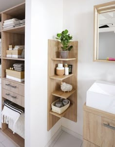 the bathroom is clean and ready to be used as a storage area for towels or other items