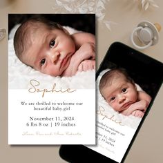 an image of a baby's birth announcement on a cell phone next to it