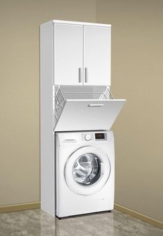 a white washer sitting next to a tall cabinet