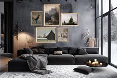 a living room filled with furniture and pictures on the wall