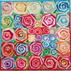 a colorful quilt with many different colors on it