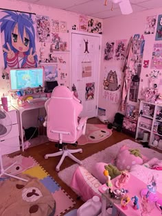 a room with pink walls and lots of stuffed animals on the floor in front of a computer desk