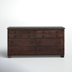 a wooden dresser with several drawers on it