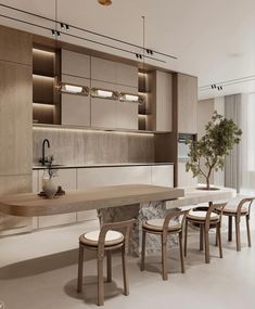 a modern kitchen with an island table surrounded by chairs