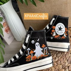 Mushroom Ghost Hand Embroidery Converse, Spooky Boo Embroidered  Hi Top Shoes, Custom Halloween Cute Ghost Face With Mushrooms and Pumpkins The Mushroom Ghost Hand Embroidery Converse are custom high-top sneakers that feature a whimsical design perfect for Halloween. Each pair showcases a cute ghost face adorned with mushrooms and pumpkins, all intricately hand-embroidered to create a unique and playful aesthetic. These spooky yet charming sneakers are ideal for those looking to express their lo Shoe Design Ideas Diy, Custom Shoes Ideas, Unique Shoes Women, Hand Painted Shoes Ideas, Halloween Converse, Cute Ghost Face, Mushroom Ghost, Embroidery Converse, Cool Converse