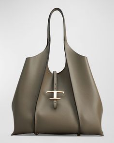 "Find TOD'S Calf Leather Shopping Tote Bag on Editorialist. Tod's shopping tote bag in calf leather Shoulder strap Open top with adjustable center Tstrap Interior, leashed zip pouch bag Feet protect bottom of bag Approx. 11.4\"H x 18.5\"W x 5.5\"D Made in Italy" Bottega Veneta Bag, T Bag, Womens Designer Handbags, Top Handle Handbags, Leather Shops, Shopping Tote Bag, Zip Pouch, Goodie Bags, Shopping Tote