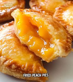 some fried peach pies on a white plate