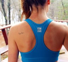 a woman with a tattoo on her back