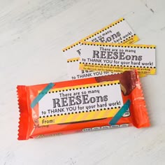 three candy bar wrappers sitting on top of each other