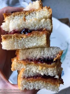 three jelly filled sandwiches stacked on top of each other