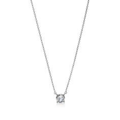 Legendary diamonds of superlative cut, color, clarity and brilliance. Pendant in platinum with a round brilliant diamond. On a 16" chain. Round brilliant diamond, carat weight .78, color grade F, clarity grade VS1 | Tiffany Solitaire Diamond Pendant in Platinum Tiffany Solitaire, Solitaire Diamond Pendant, Color Grading, Round Brilliant, Diamond Pendant, Platinum, Pendant Necklace, Chain, Pendant