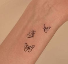 three butterflies tattoo on the wrist