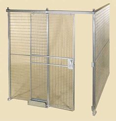 a large metal cage is open on the floor and has two doors that are closed