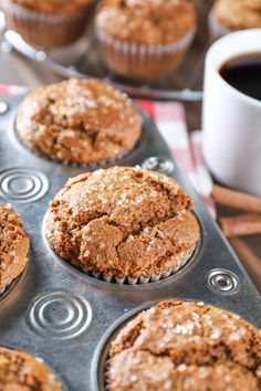 freshly baked muffins sitting in a muffin tin