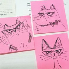 three drawings of cats on pink paper next to each other