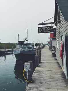 a boat is docked at the dock in front of a building with a sign that says diversion