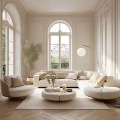 a living room filled with white furniture and large windows in the wall next to each other