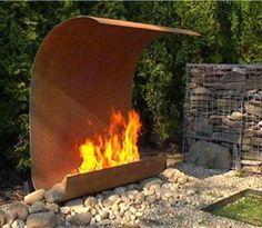 a fire pit in the middle of some rocks