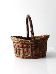 a wicker basket sitting on top of a white counter