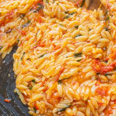 some kind of food that is being cooked in a pan