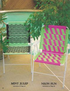 two lawn chairs sitting next to each other in front of a pool