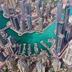 an aerial view of the city and its marina in abu, united arab emirates region