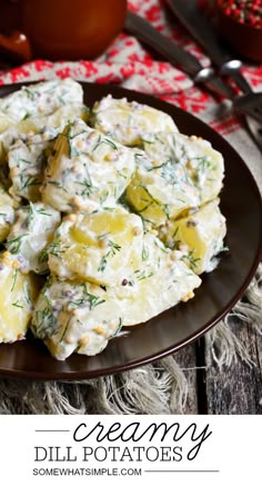 creamy dill potato salad on a brown plate with a red and white tablecloth