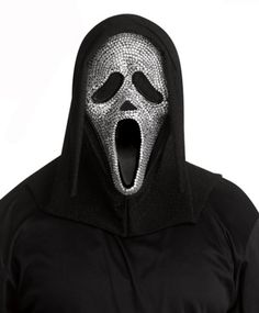 Believe it or not, Ghost Face knows a thing or two about fashion. Complete your horrifying Halloween look when you get this officially licensed Ghost Face Bling Full Mask. Get ready to shine while you terrorize the neighborhood! Officially licensed Dimensions: Width: About 9" at widest point Height: About 18" at highest point Depth: About 2.5" Material: Plastic, polyester Care: Spot clean Imported Note: Robe sold separately Ghost Face is a registered trademark of Fun World Div., Easter Unlimited Ghostface Mask, Scream Costume, Ghost Face Mask, Black Cloak, Spencers Gifts, Black Hood, Ghost Face, Fun World, Ghost Faces