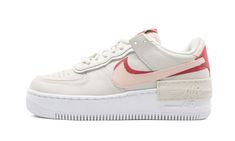 The Nike Air Force 1 Shadow is a women's style with a design that has us seeing double.  Dubbed the "Phantom" colorway, this AF1 takes the iconic sneaker silhouette and adds shades of pink and red to a cream-colored leather base.  Layered milky white paneling at the eyestay adds a dimensional effect.  Also doubled up are the sneaker’s Swoosh and midsole “AIR” branding found on the lateral side and in two spots at the heel.  Below, a crisp white sole holds Nike Air cushioning and a rubber tractio Shadow Phantom, Shadow Shoes, Yeezy 750, Nike X Travis Scott, Nike Air Force 1 Shadow, Air Force 1 Shadow, Nike Air Force One, Low Air Jordan 1, Jordan 8